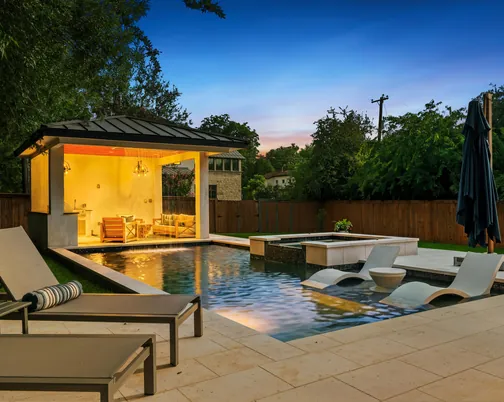 Mahncke Park - twilight backyard patio with pool and spa