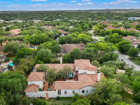 Shavano Park - aerial view of a Mediterranean-style home with a red tile roof