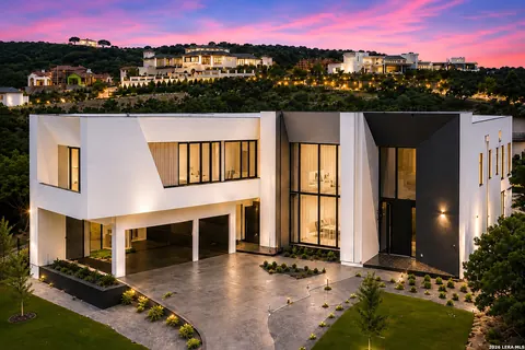 The Dominion - twilight aerial view of a modern estate overlooking the hill country